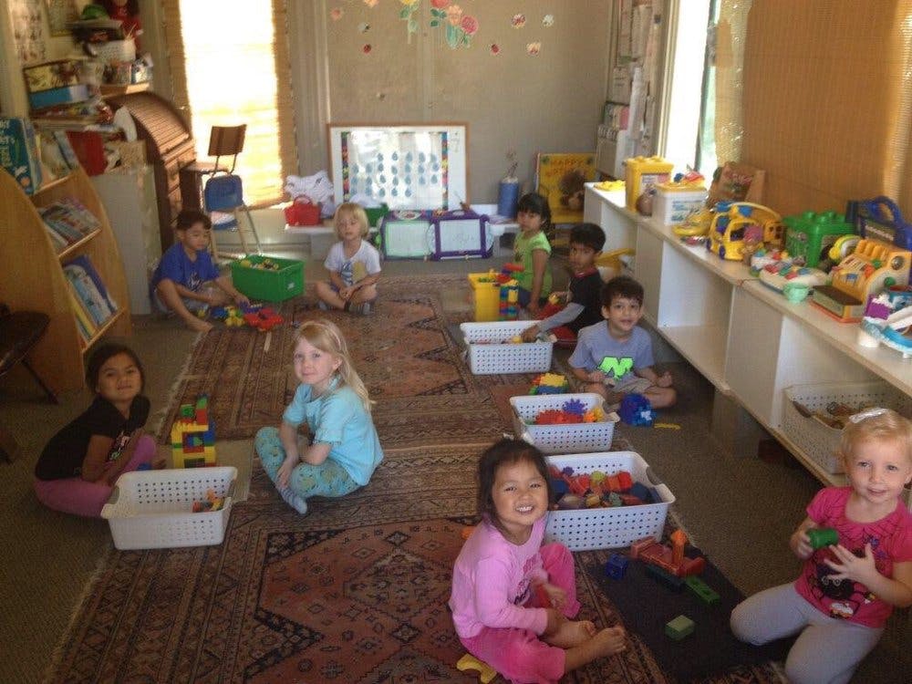 Children playing with toys in a classroom