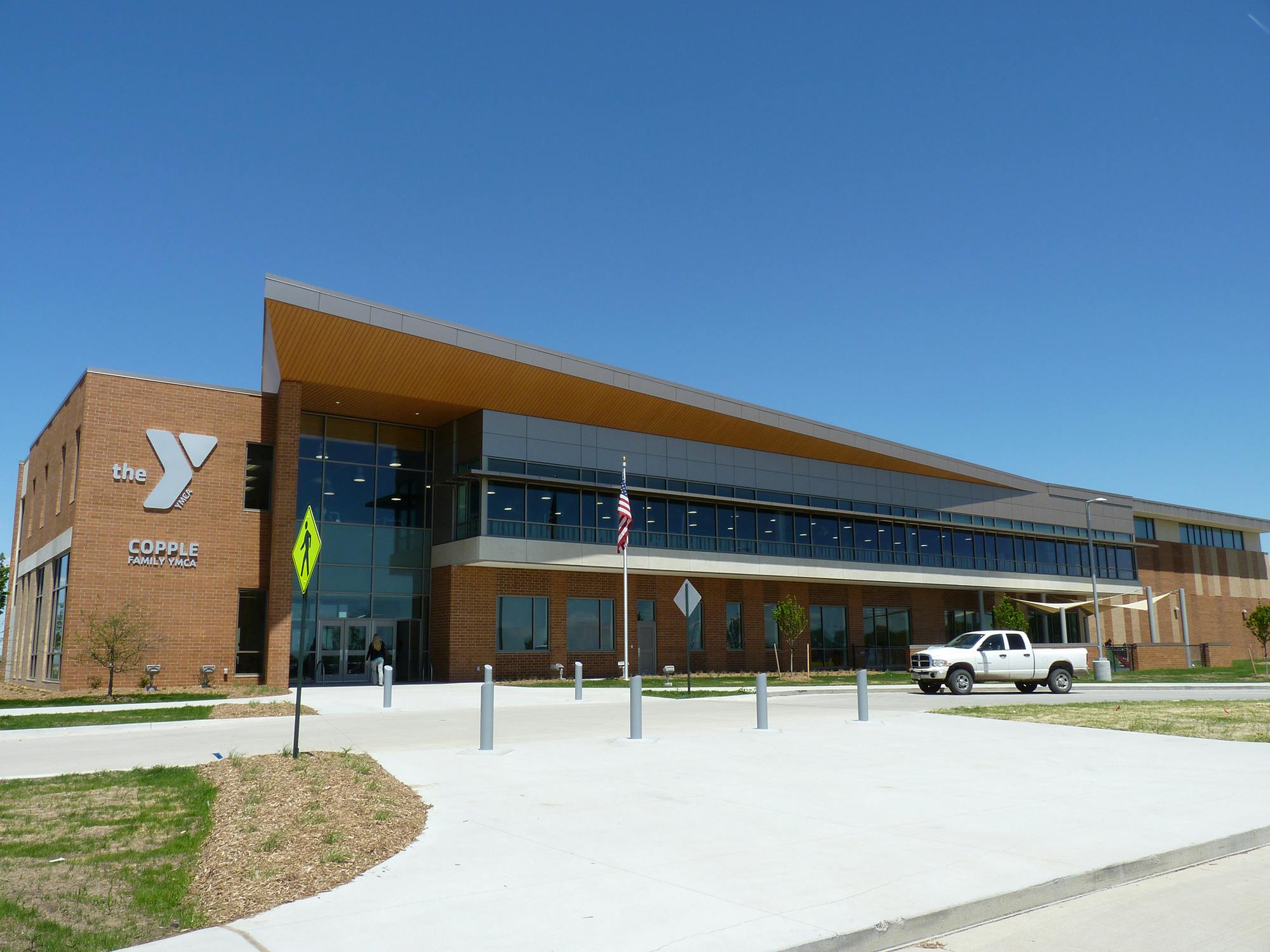 Modern building with a large YMCA logo on the side