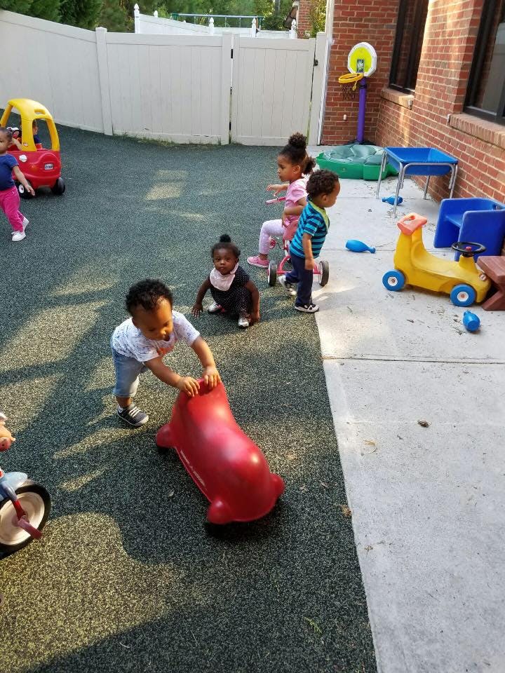 Children playing with toys on a playground