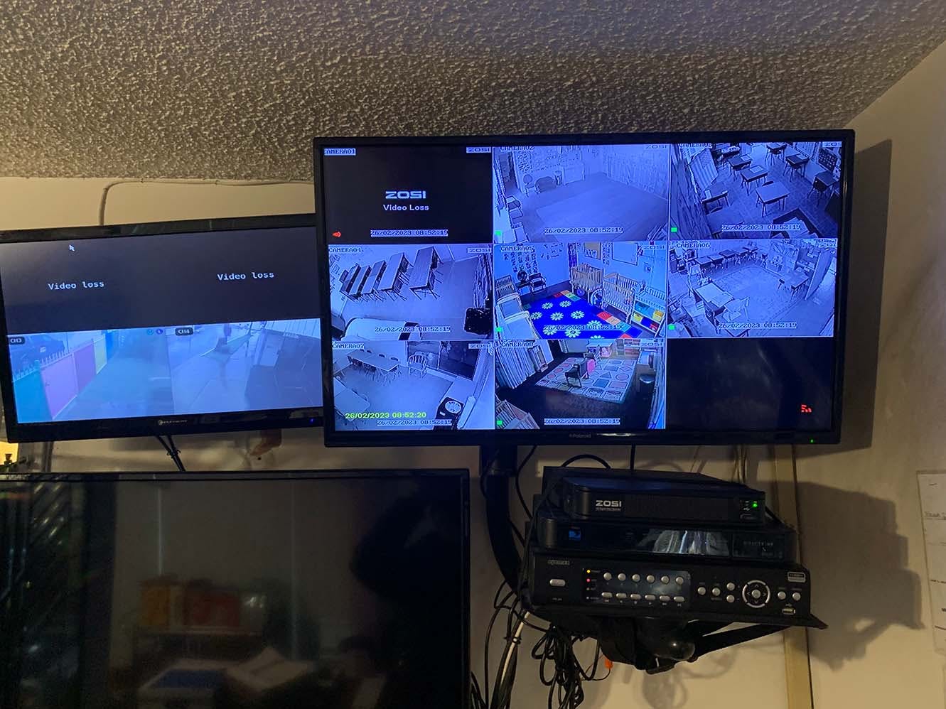 multiple monitors displaying security camera feeds, some showing 'video loss'