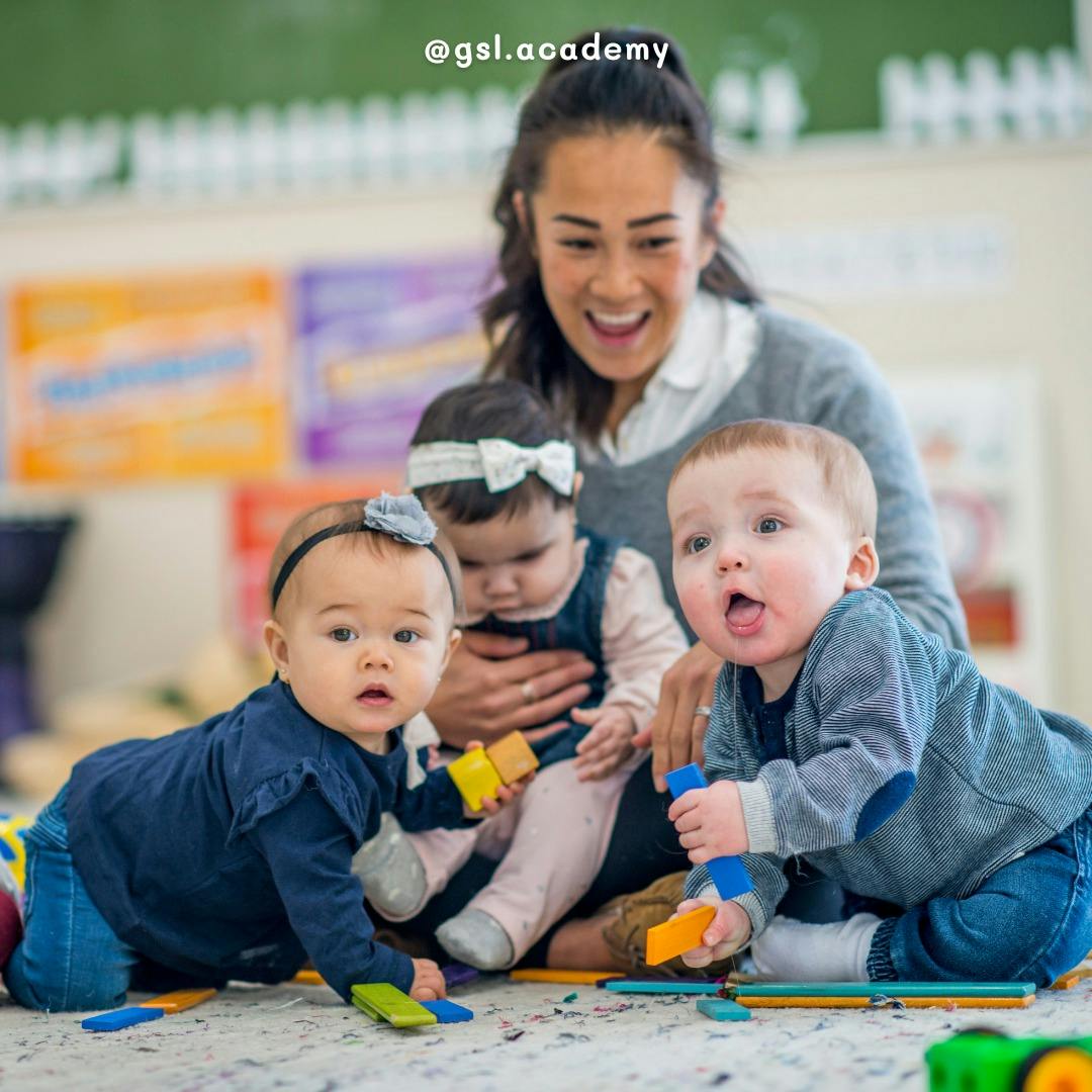 Person with three children playing with toys