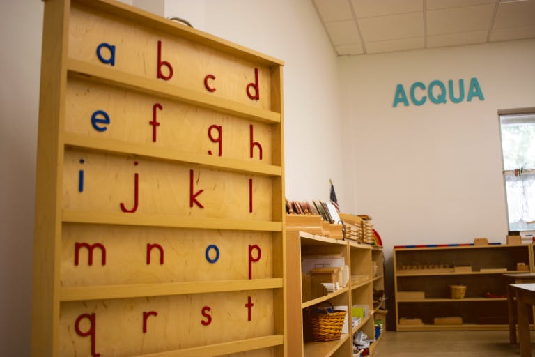Wooden shelves with alphabet letters in a classroom