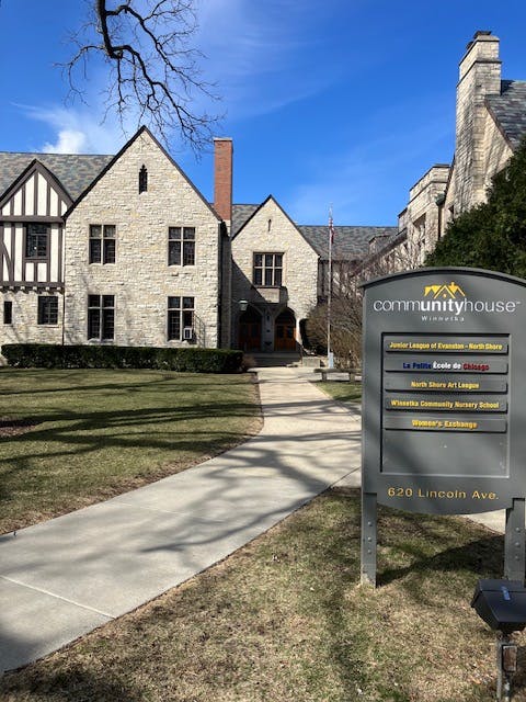 Stone building with a sign for CommunityHouse Winnetka