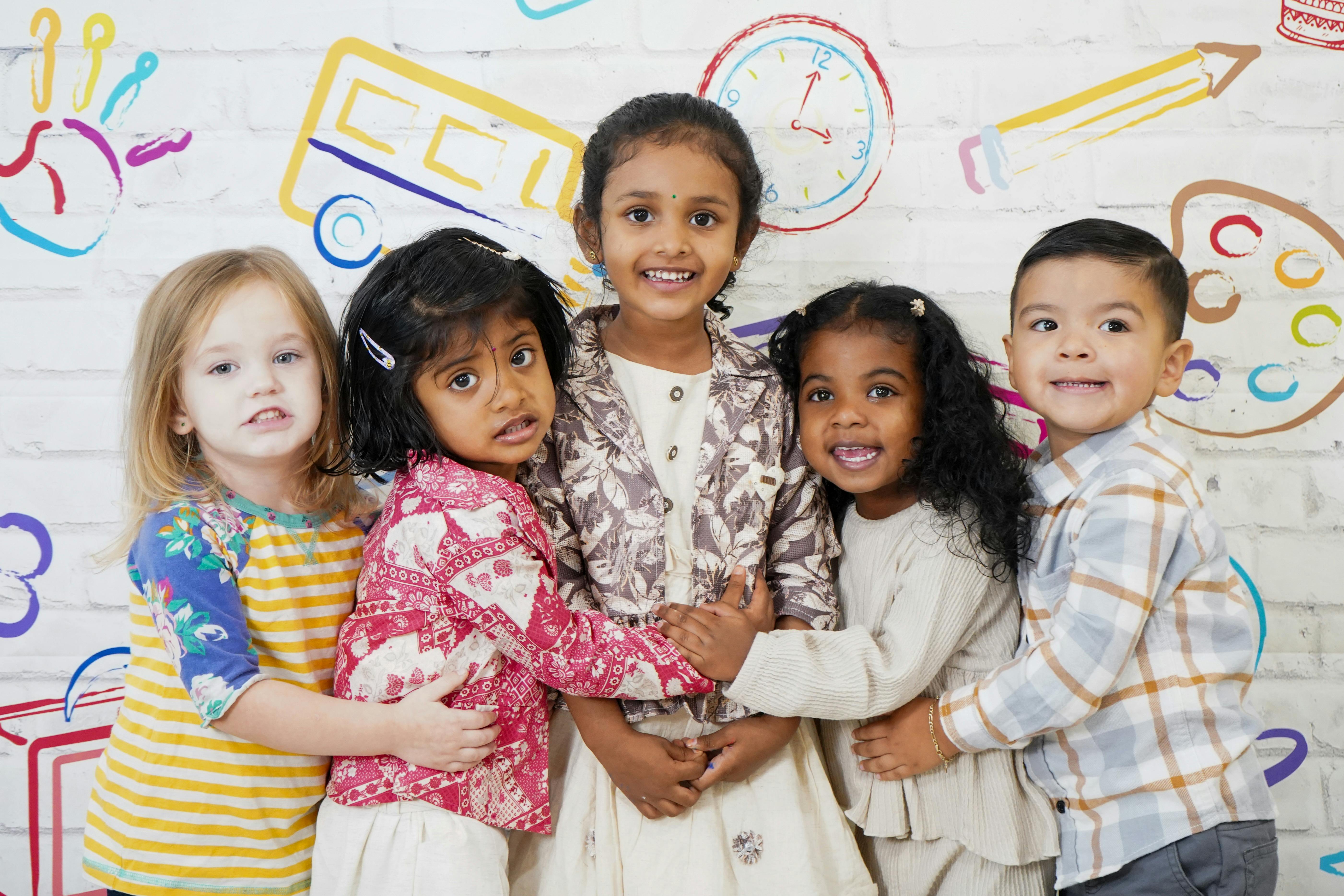Five children standing together and smiling