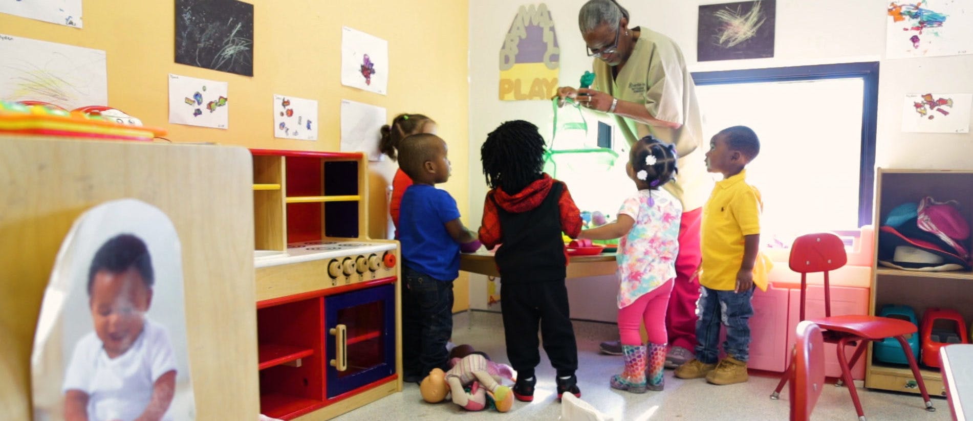Adult and children in a classroom