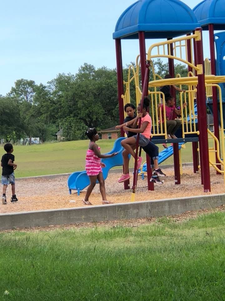 Children playing on a playground structure