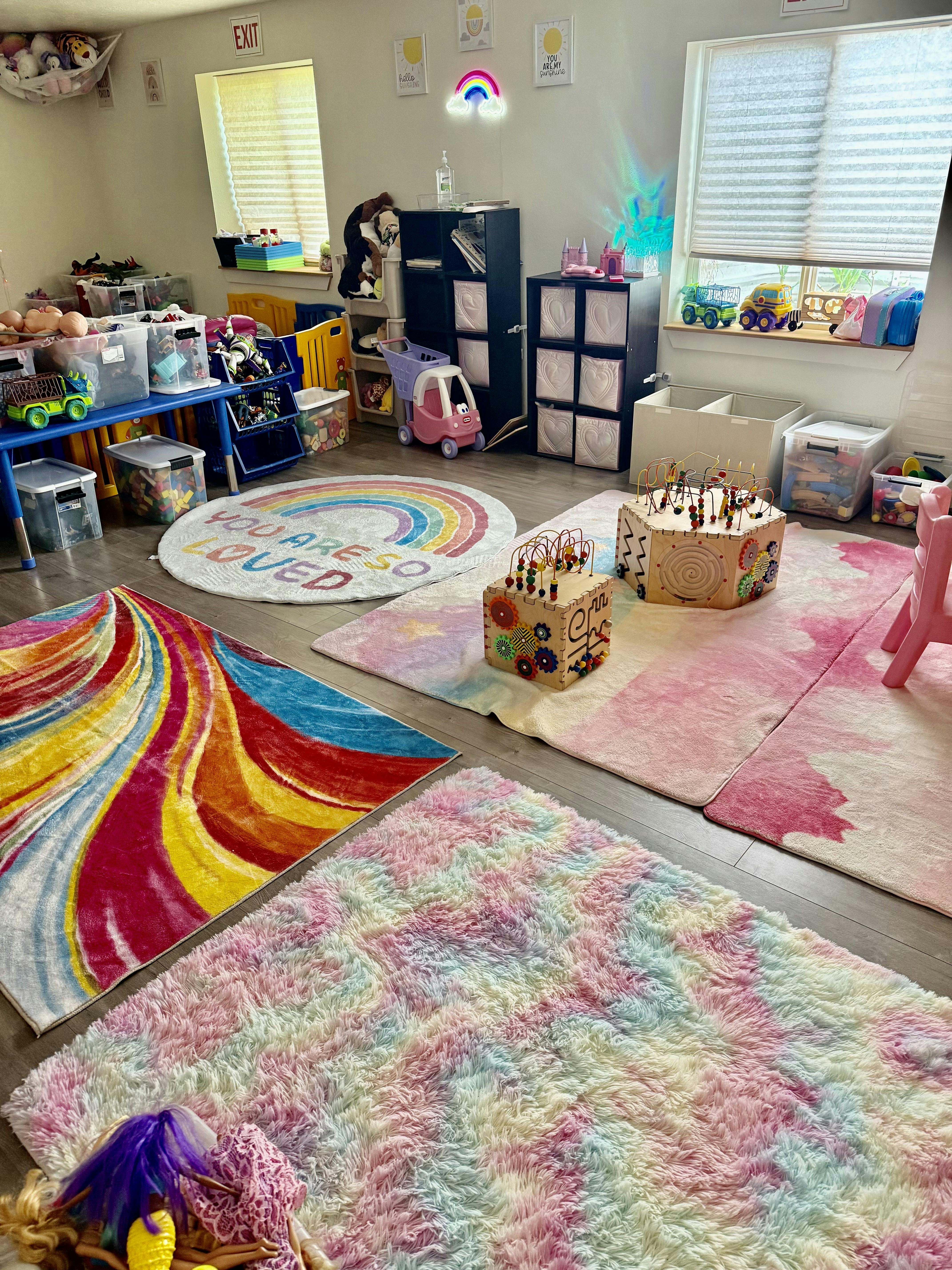 Playroom with area rugs and wooden bead maze toys