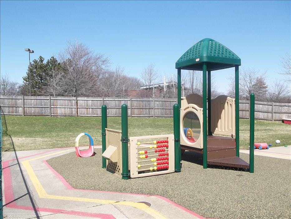 A colorful playground with an abacus and steps on a sunny day