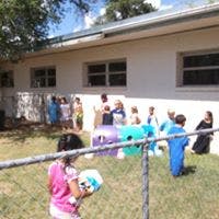 People gathered outdoors near a building