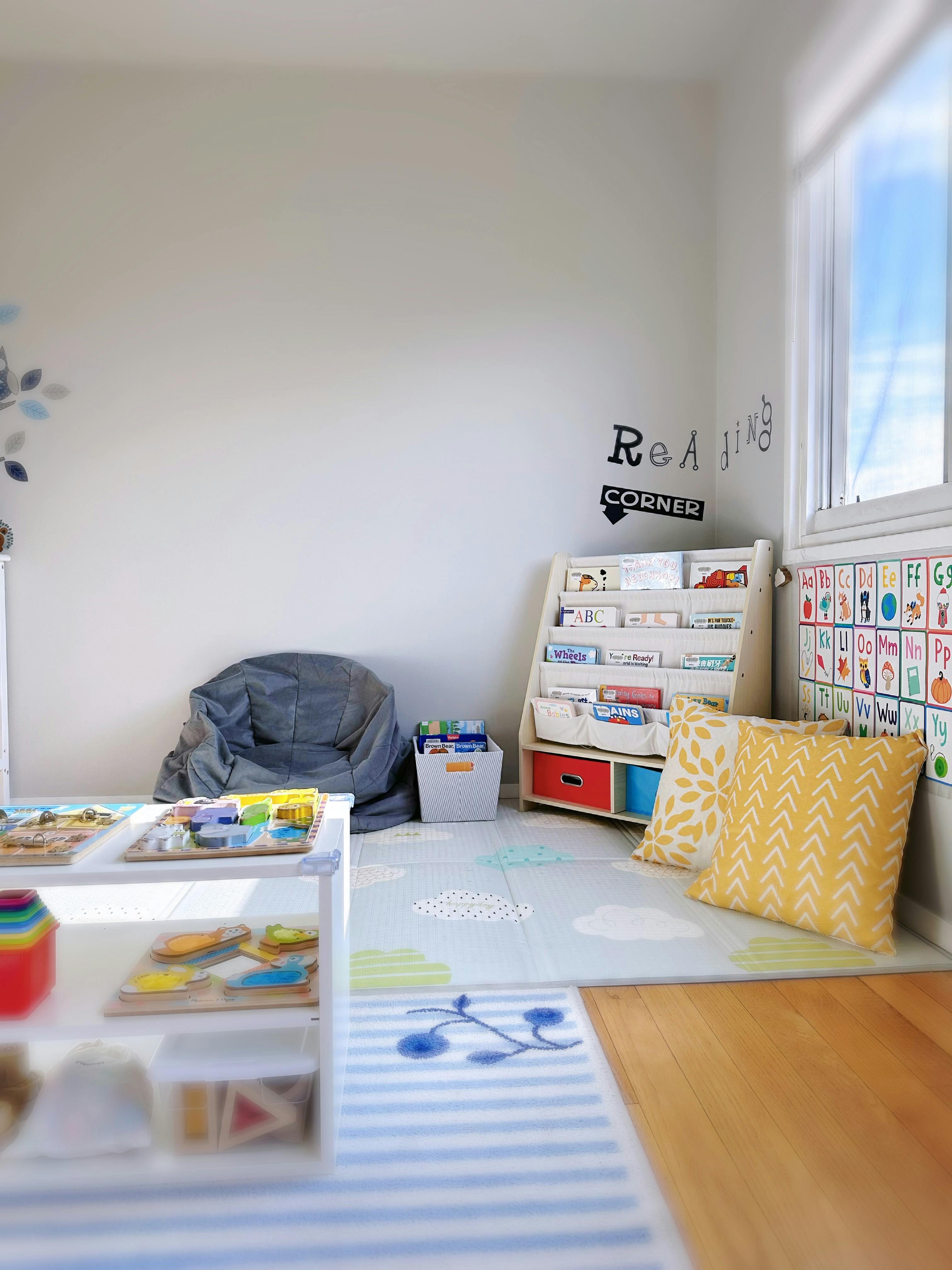 Children's play area with a bookshelf, beanbag chair, and puzzles
