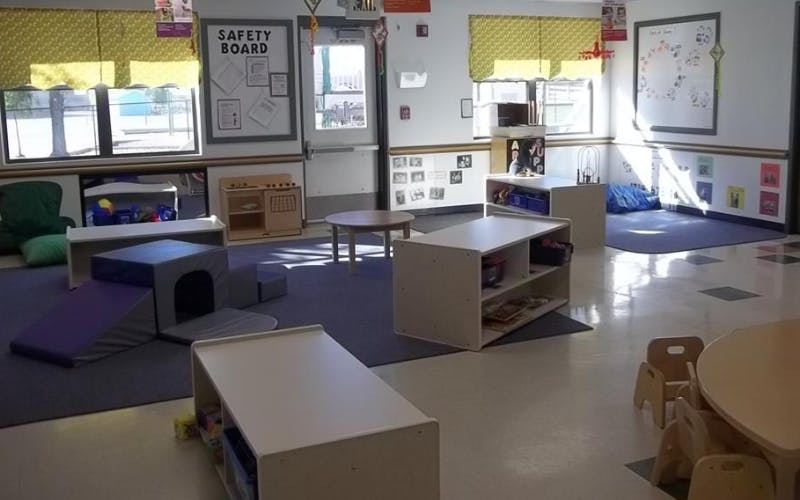 Empty classroom with activity furniture and a "SAFETY BOARD" sign