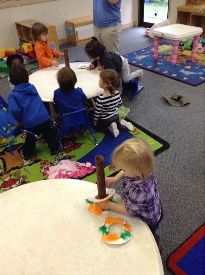 Children at small tables in a classroom