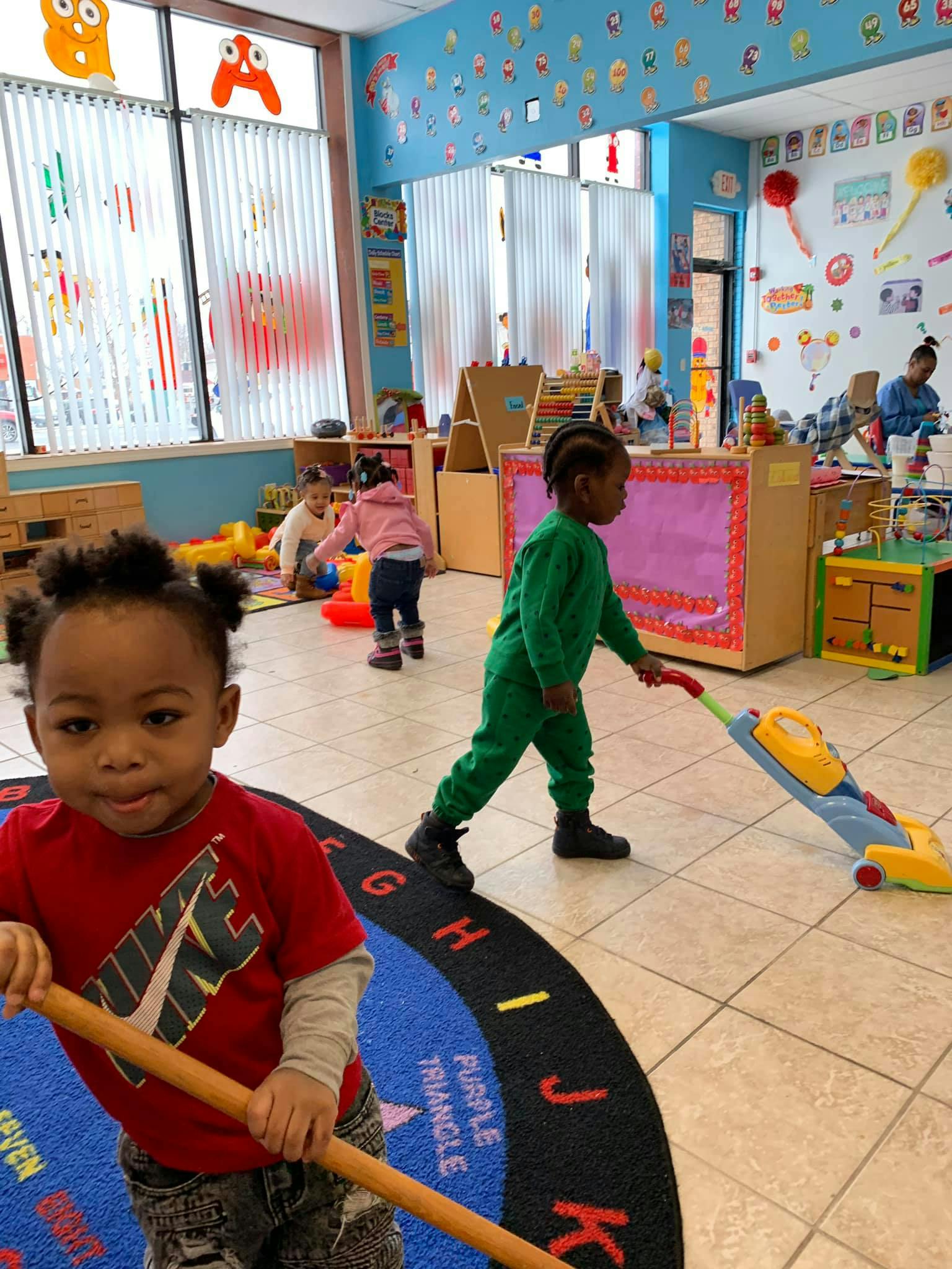 Children playing with toys in a classroom