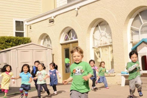 Group of children running outdoors