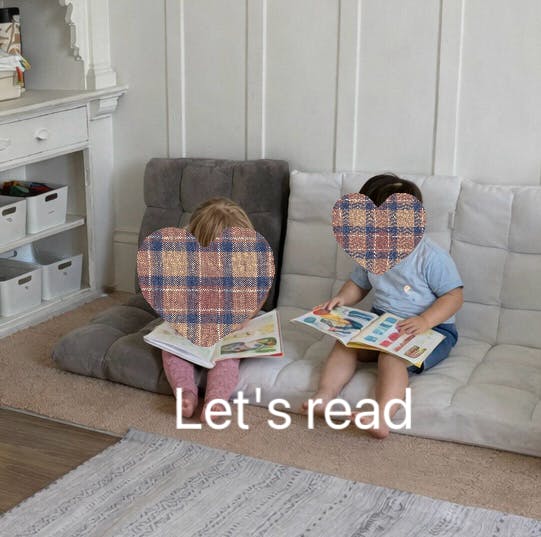 Two children sitting on floor cushions reading books, with "Let's read" text