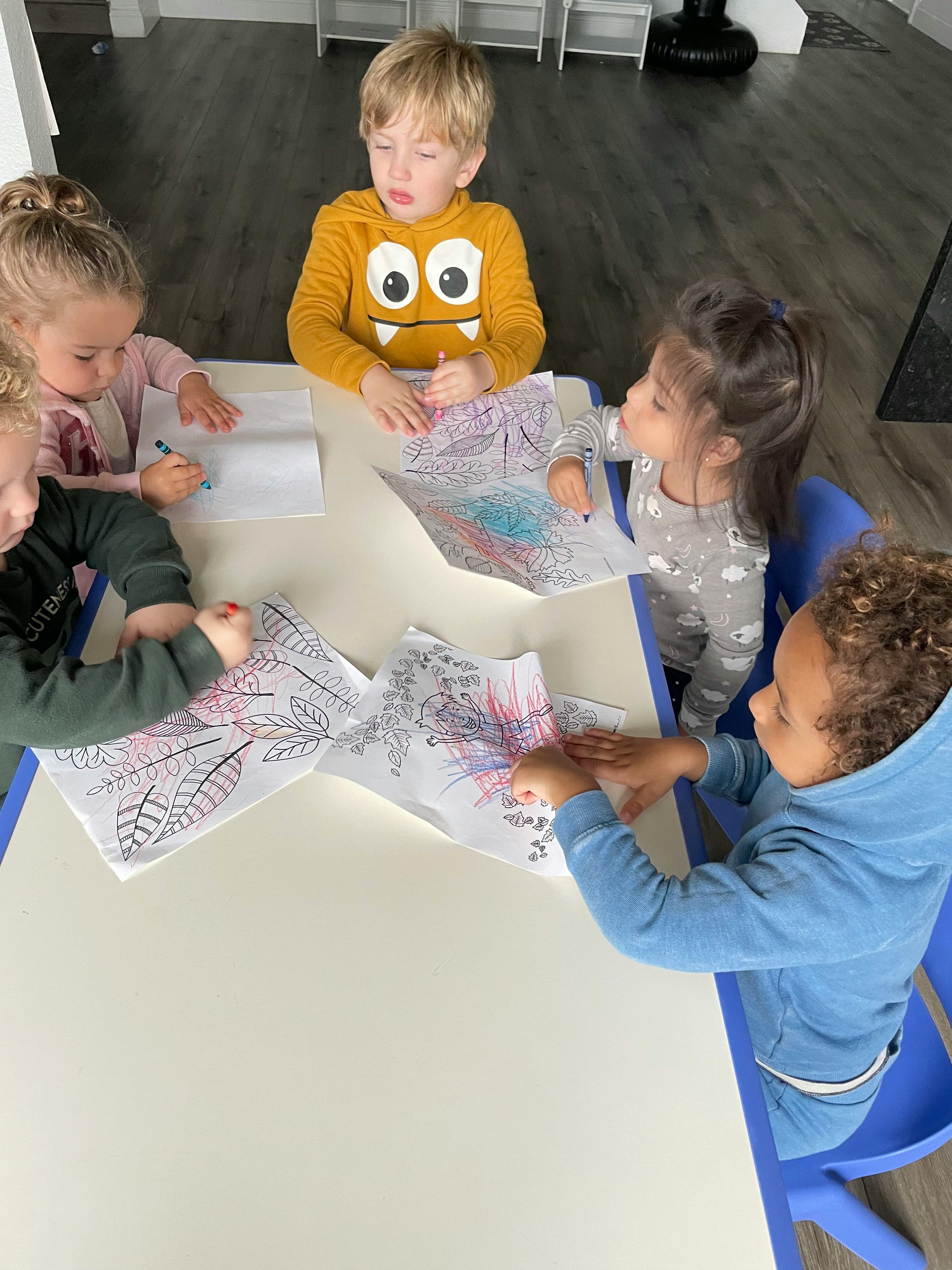 Children coloring at a table