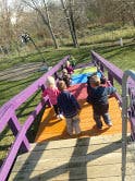 Children playing on a colorful bridge