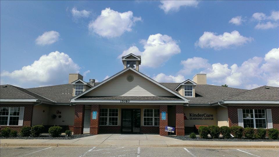 A beige and brick building with 'KinderCare Learning Center' on the facade