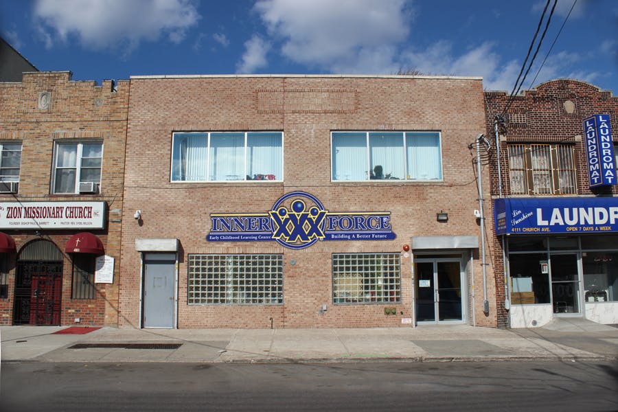 Brick building with a blue sign that reads "Brooklyn Jubilee"