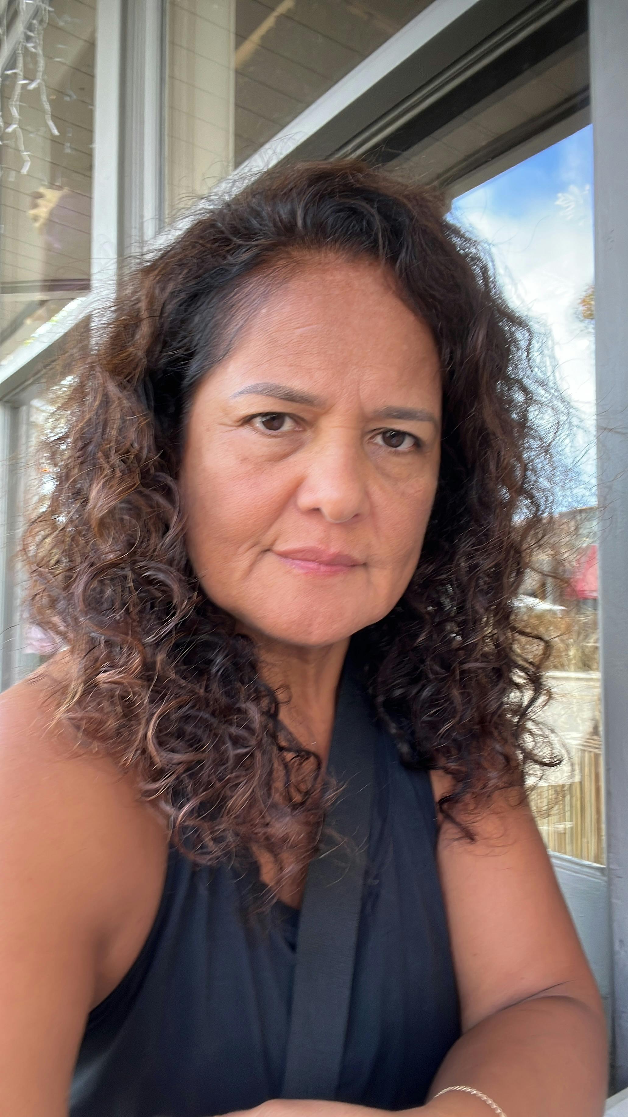 Close-up portrait of a person with curly hair
