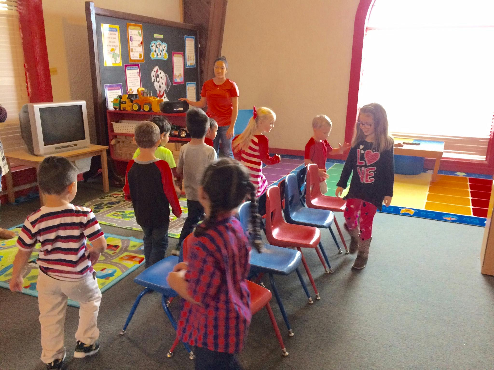 Children and an adult in a classroom