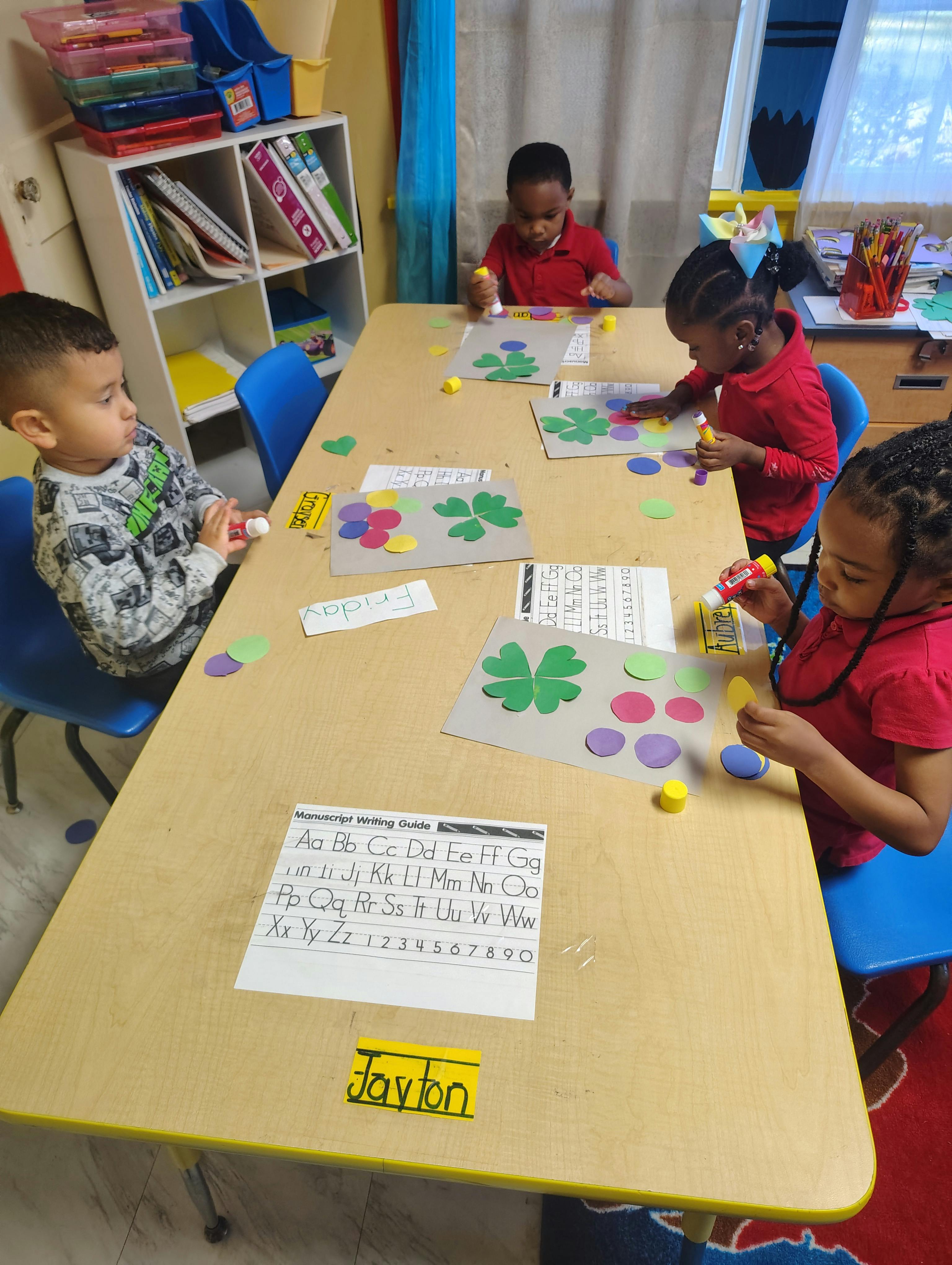 Children at a table doing crafts in-class activities