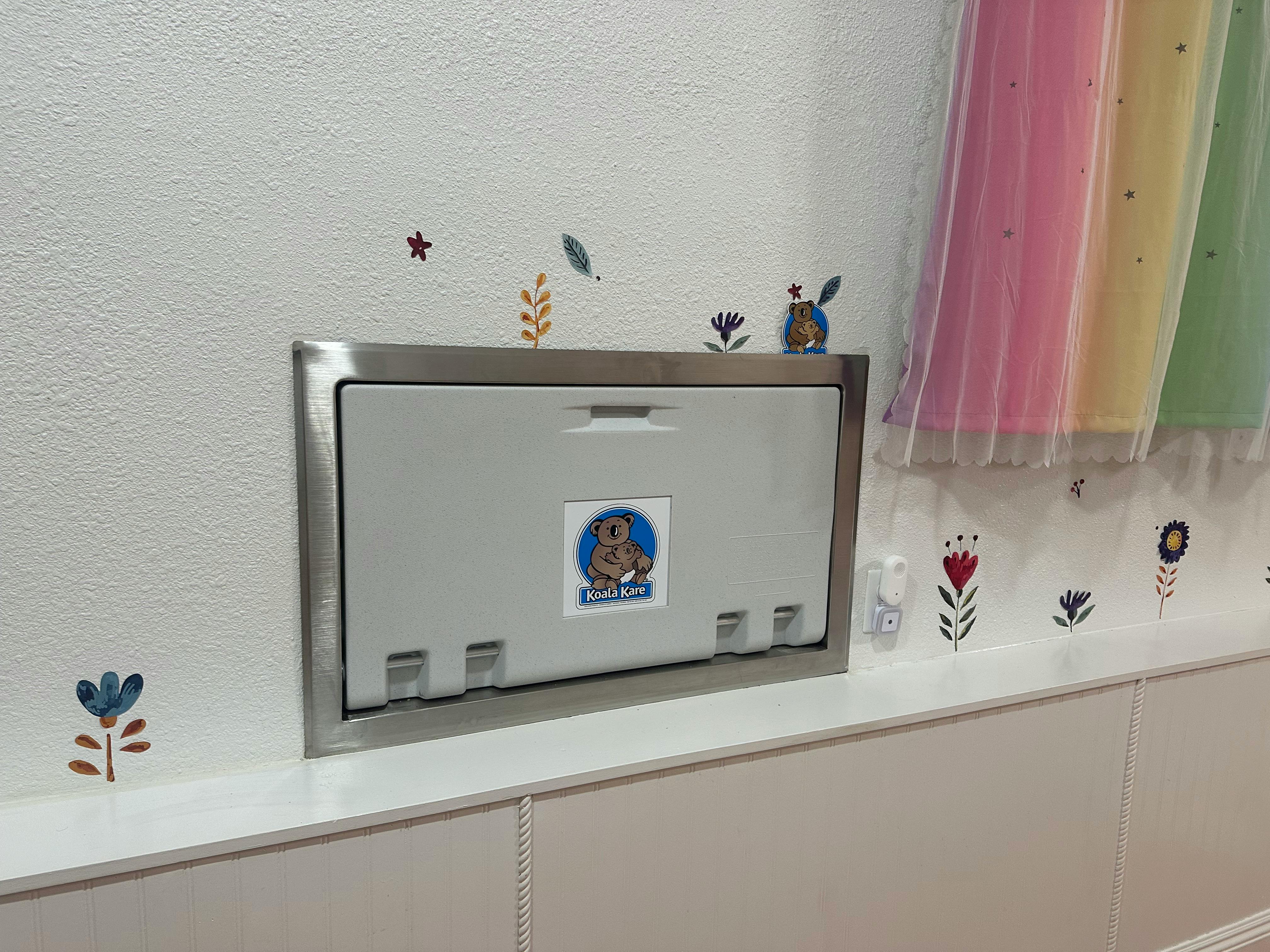 Baby changing station on a wall