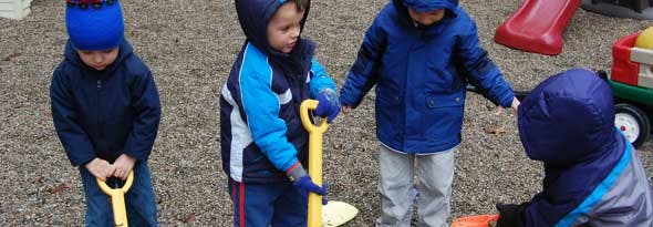 Children playing with shovels outdoors