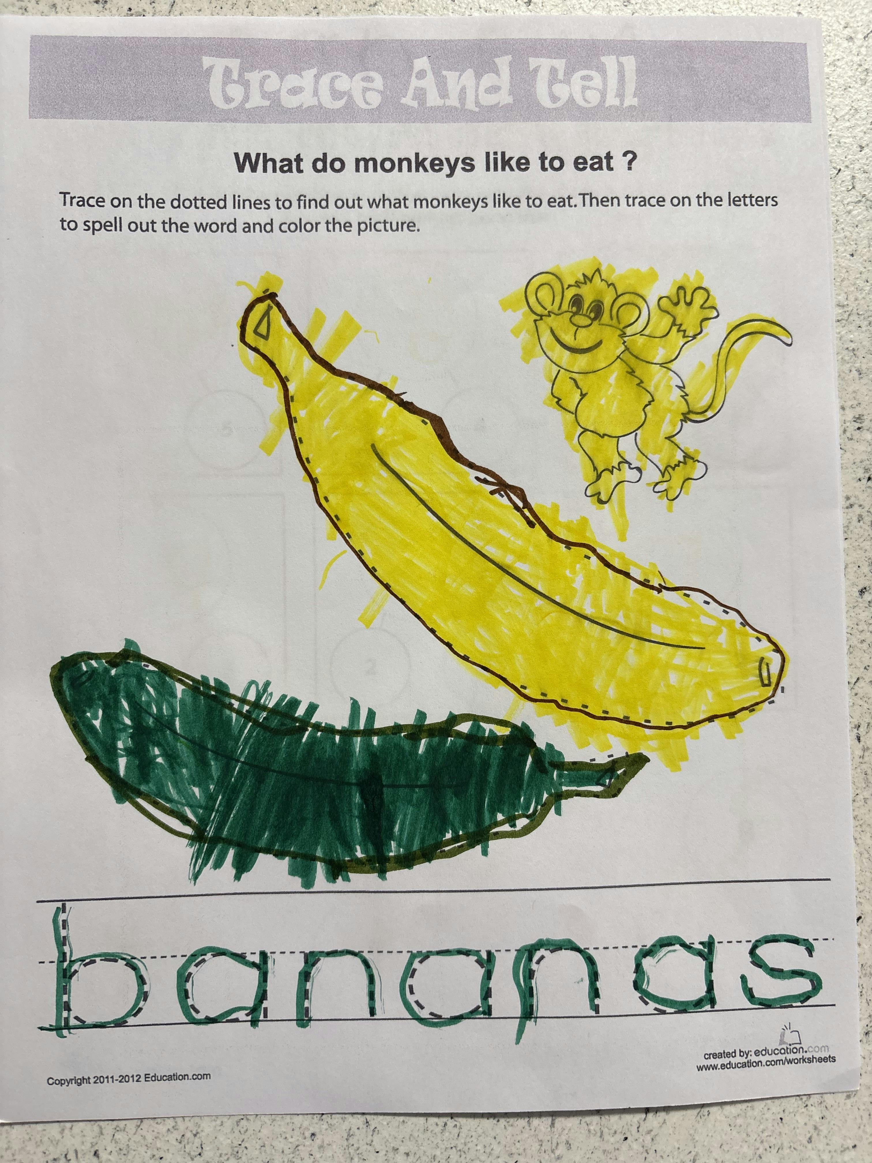 Child's worksheet with a banana, a monkey, and the word "bananas" traced