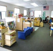 Classroom with blue chairs and learning materials