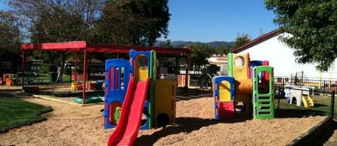 Playground with slides and climbing structures on sand