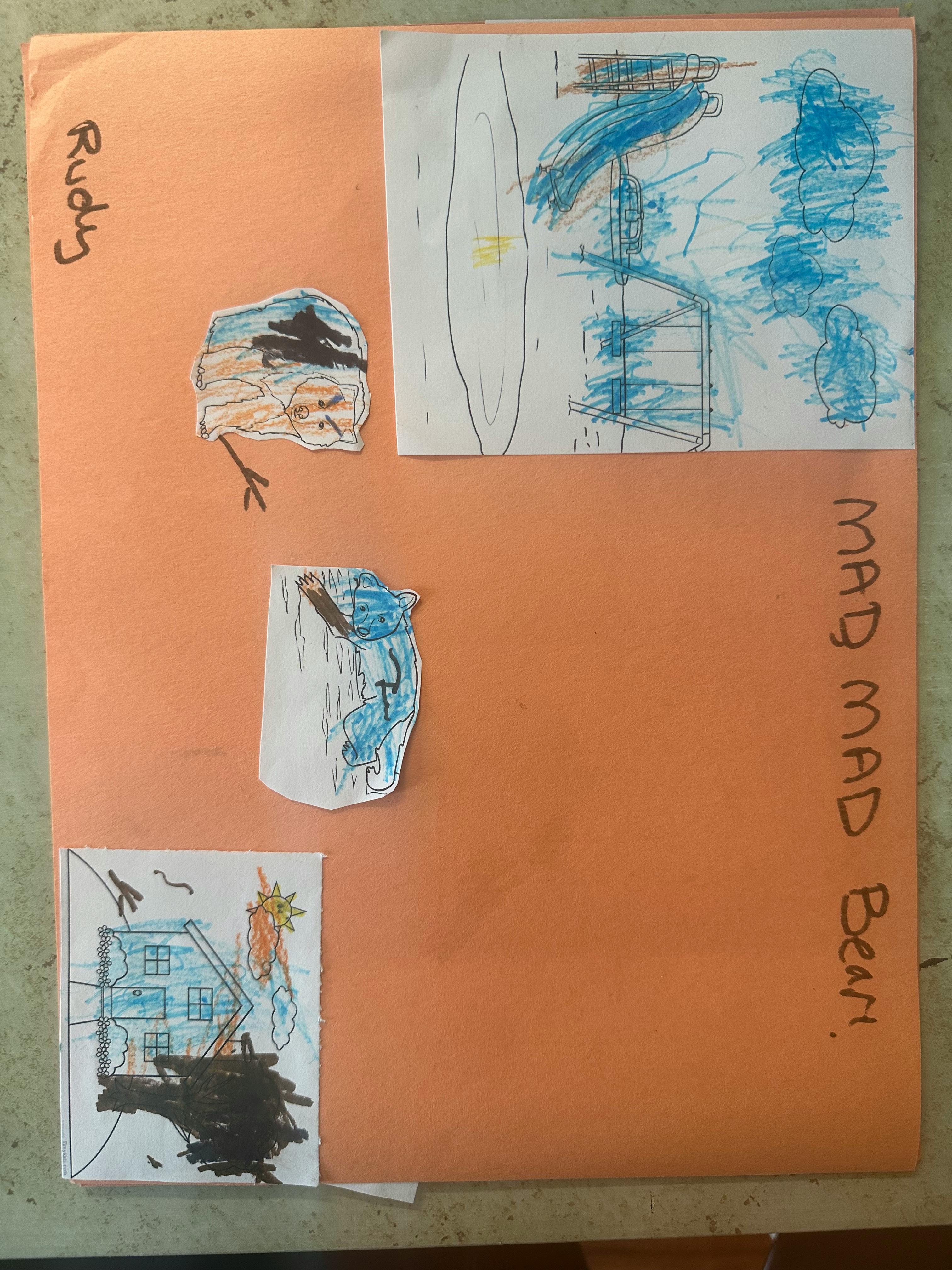 Child's artwork on orange paper with drawings of a house and abstract shapes