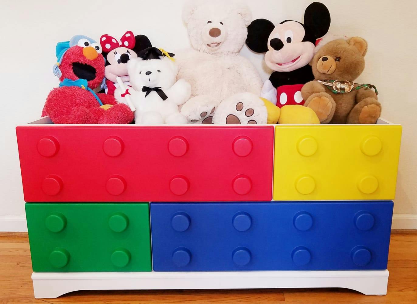 Stuffed animals in colorful toy bins