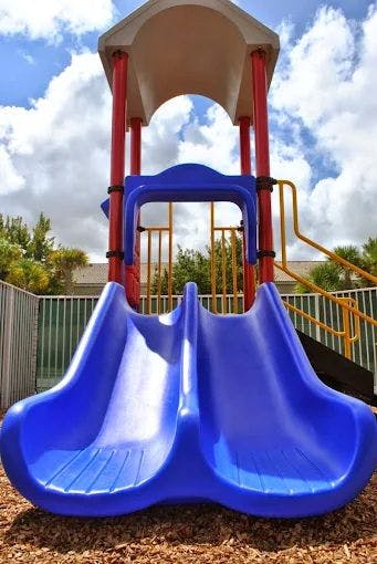 Blue double slide on a playground