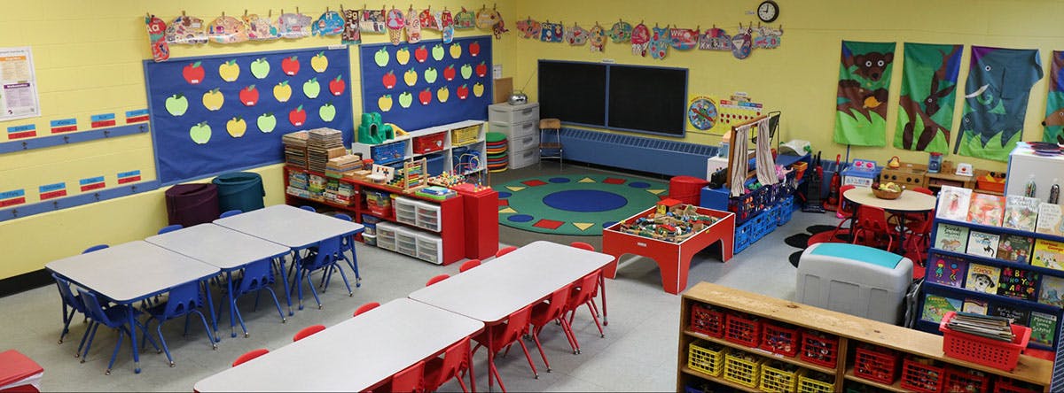 Classroom with tables, chairs, and learning materials