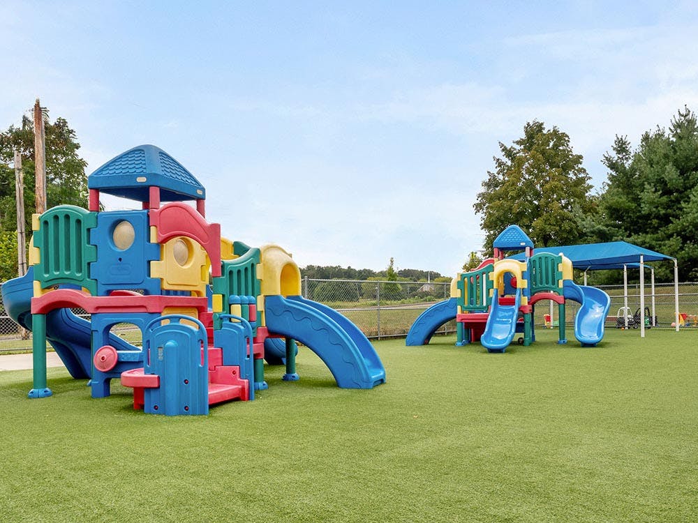 Colorful plastic playground on artificial grass