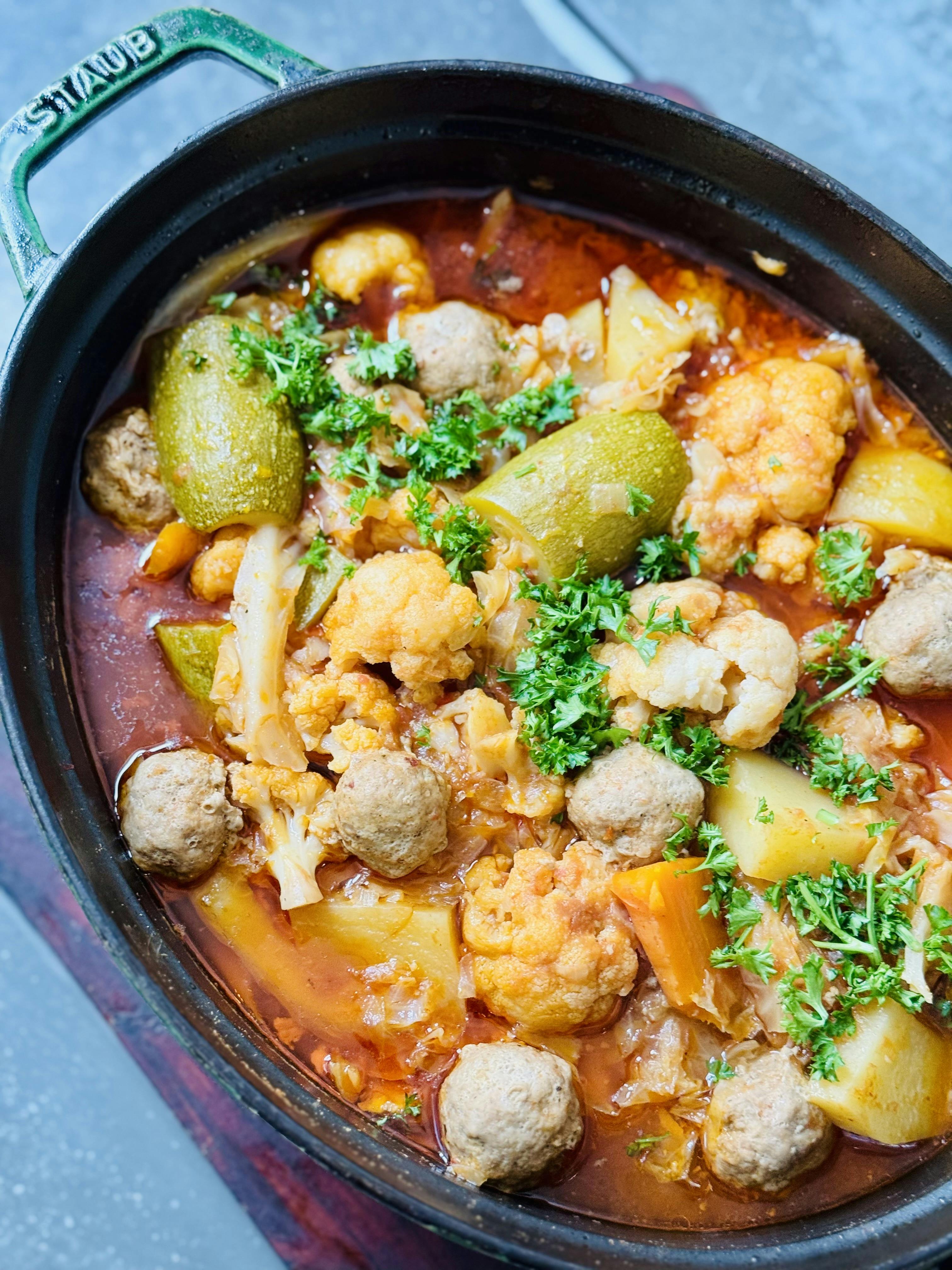 Meatballs, zucchini, and cauliflower in a stew