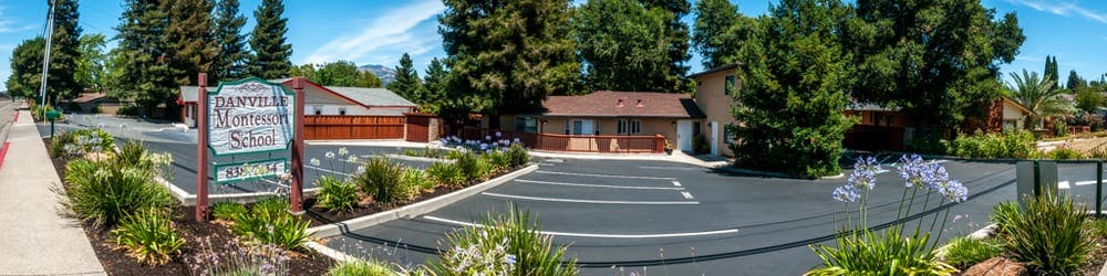 Building with a parking lot and trees