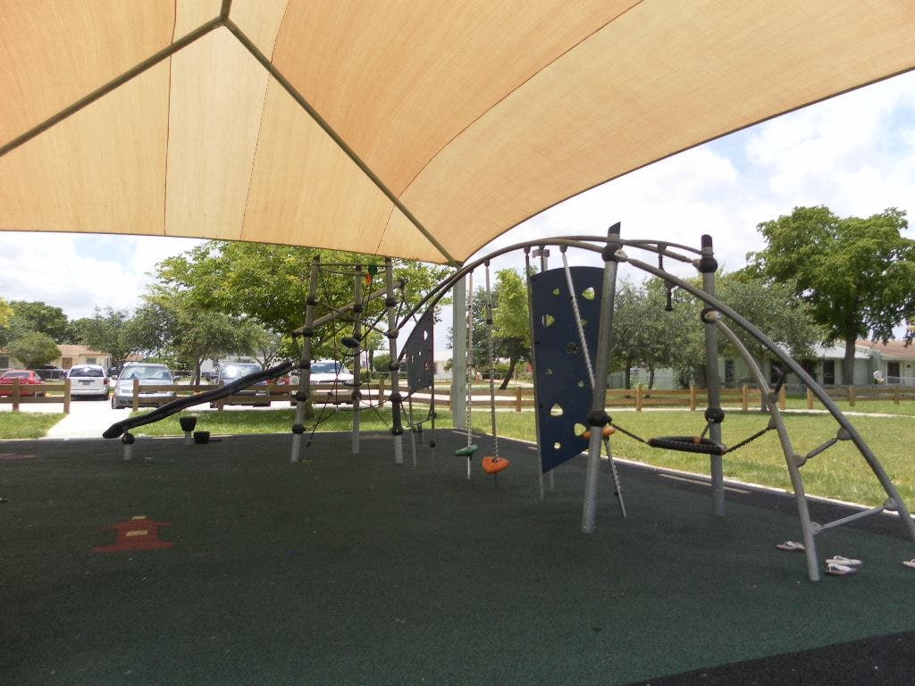 Playground with climbing structure and shade canopy