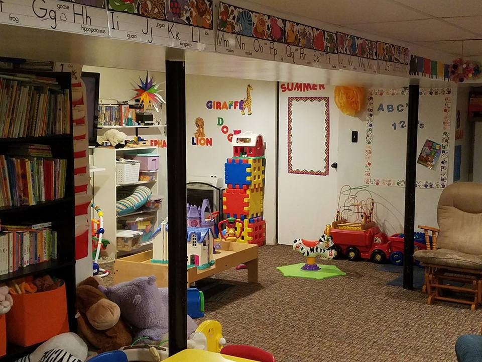 Playroom with toys, books, and learning decorations