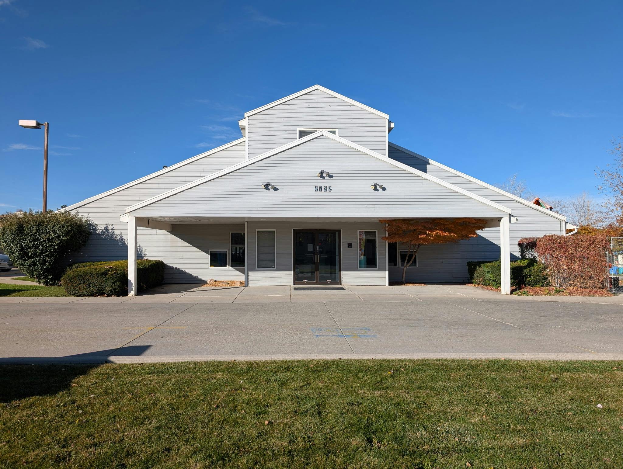 Building with a covered entrance and a number 3810 above the door