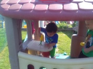 Child playing in a playhouse