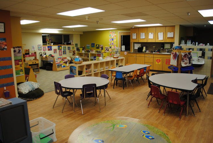 Empty classroom with tables and chairs