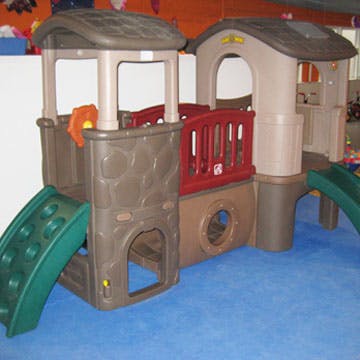 Indoor playground structure with slides