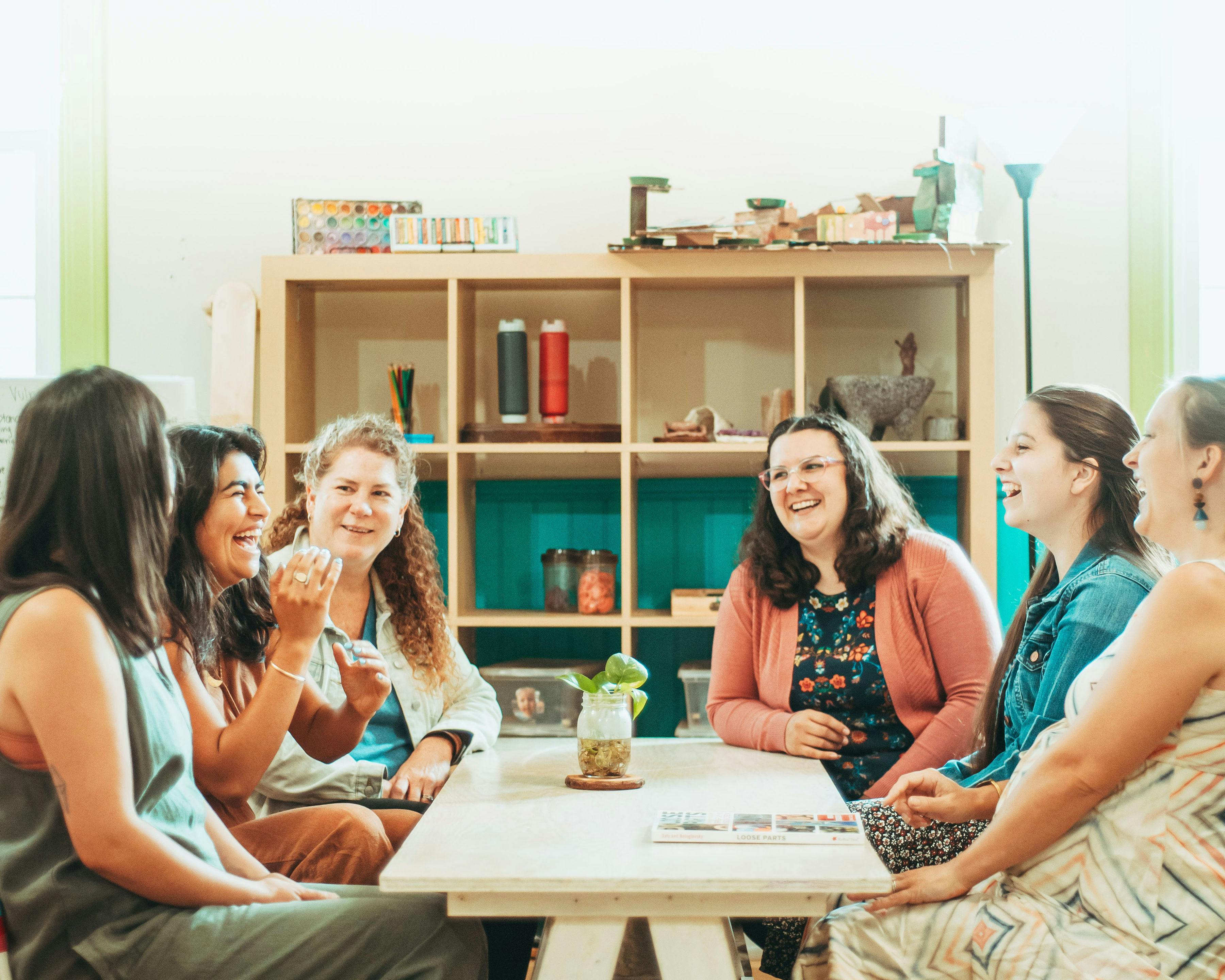Group of people sitting around a table