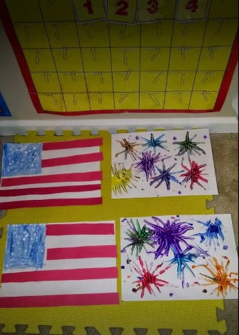 Two American flag crafts and two firework paintings