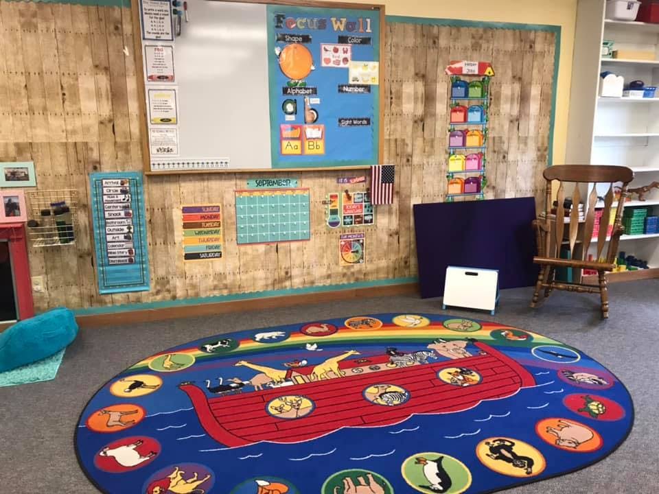 Classroom with a colorful rug depicting Noah's Ark
