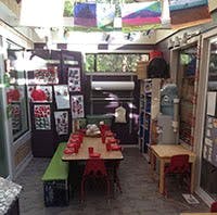 Classroom with a long table set for children