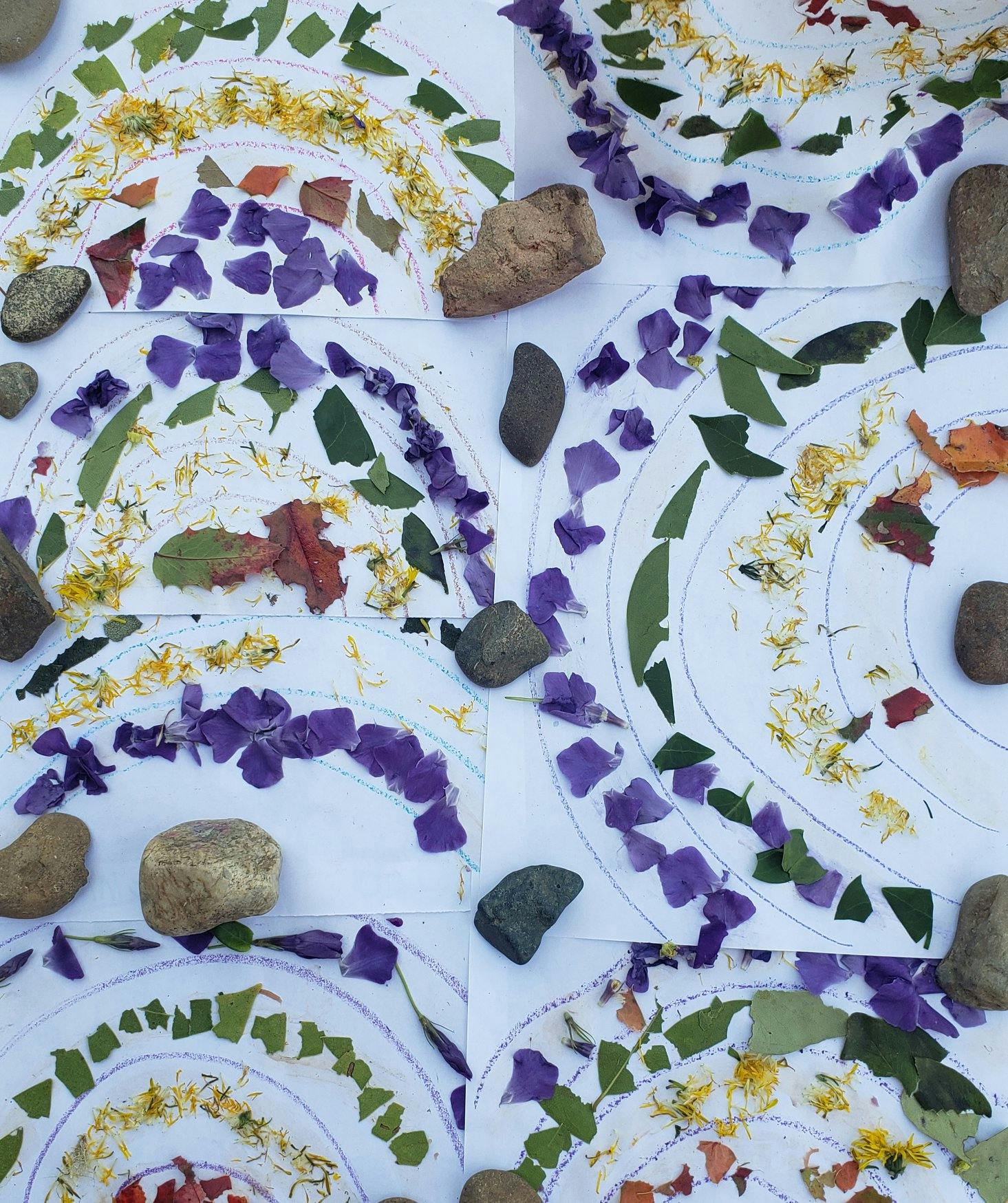 Nature art collages made with leaves, petals, and small rocks