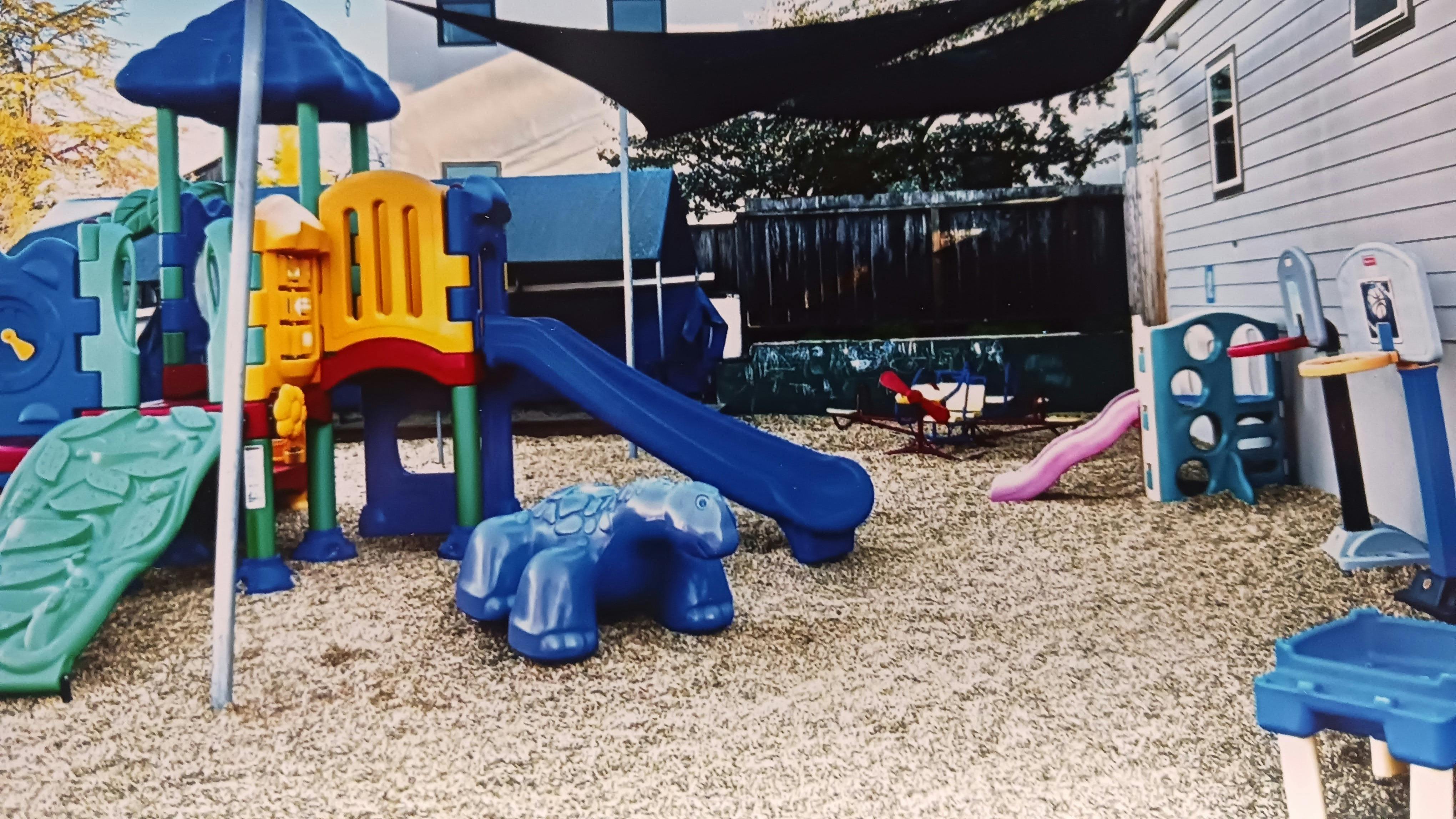 Outdoor playground with slides and climbing structures